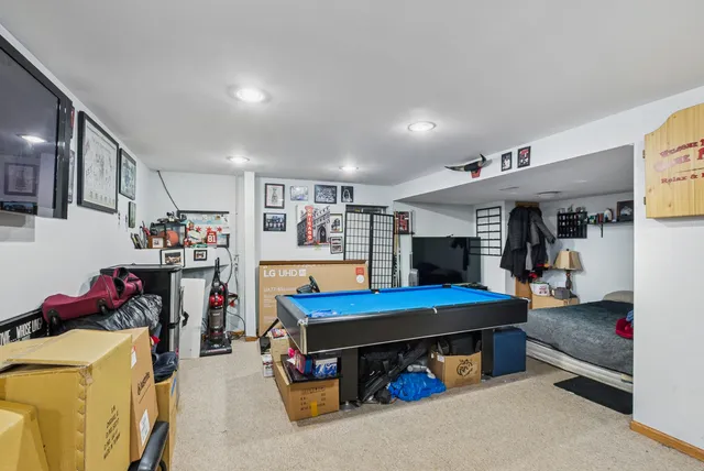 a room with furniture and a flat screen tv