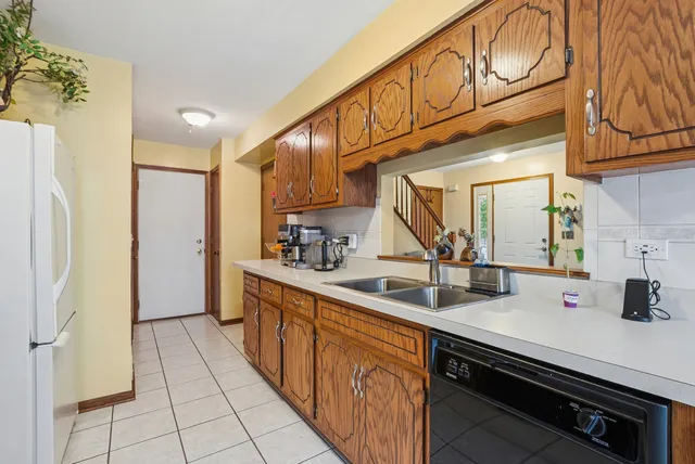 a kitchen with stainless steel appliances a sink and cabinets