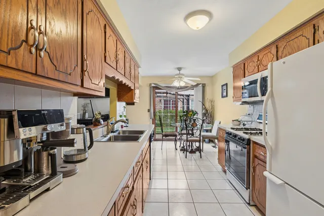a kitchen with stainless steel appliances granite countertop lots of counter top space
