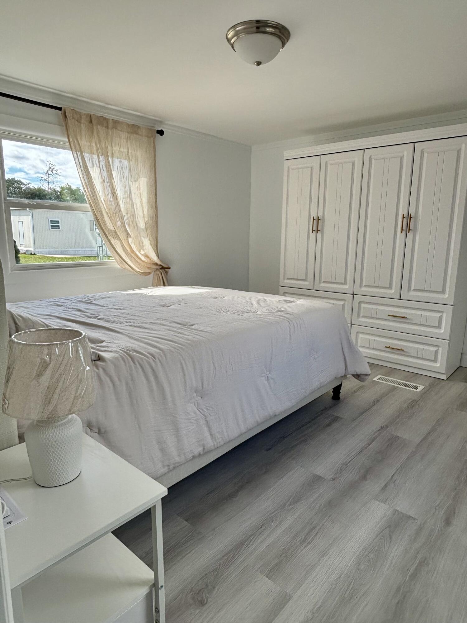3003 Bimini Bay Boynton Beach, FL 33436 - Photo 11 of 31 a bedroom with a bed and a window