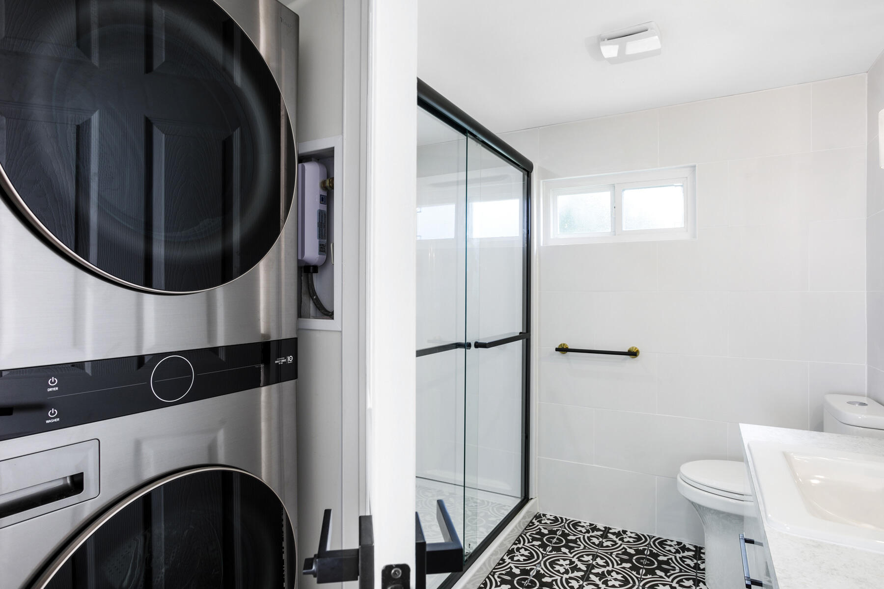 3003 Bimini Bay Boynton Beach, FL 33436 - Photo 12 of 31 a bathroom with a toilet a sink and a mirror