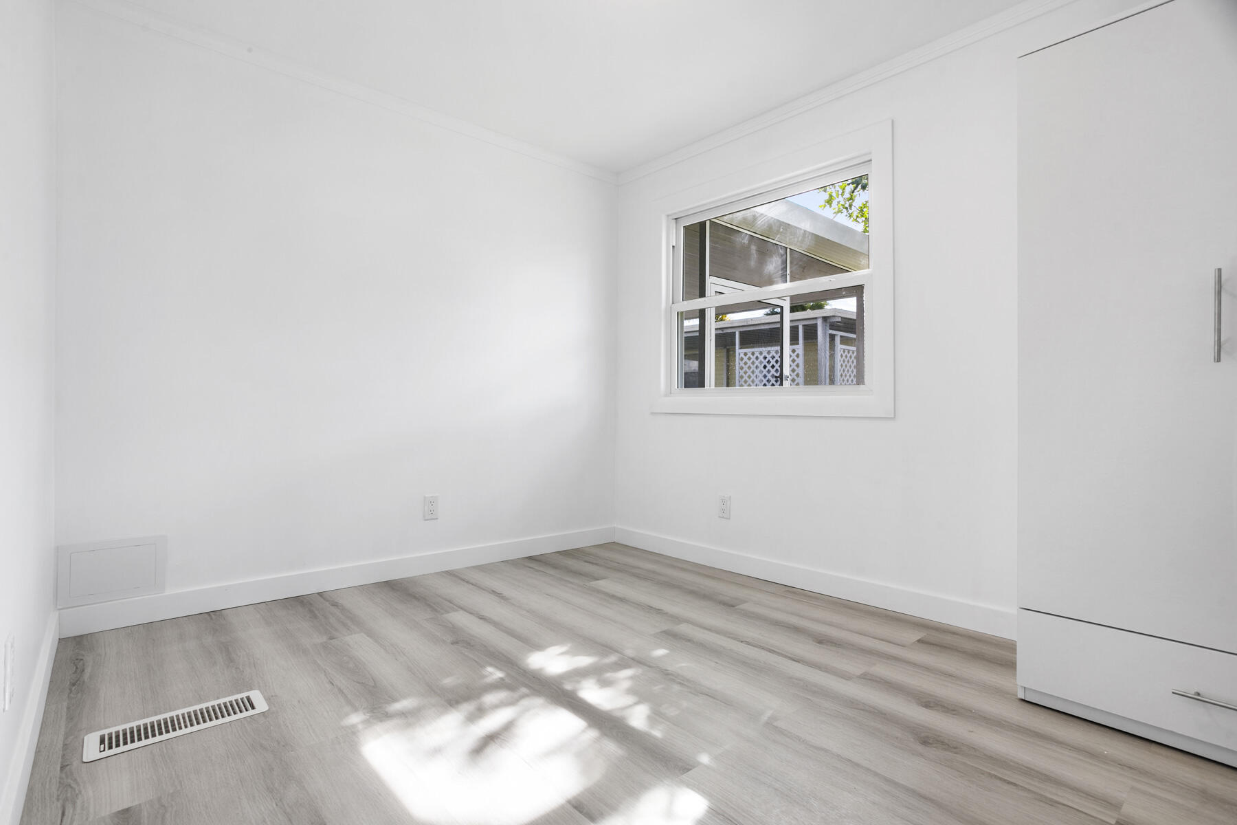 3003 Bimini Bay Boynton Beach, FL 33436 - Photo 15 of 31 an empty room with wooden floor and window
