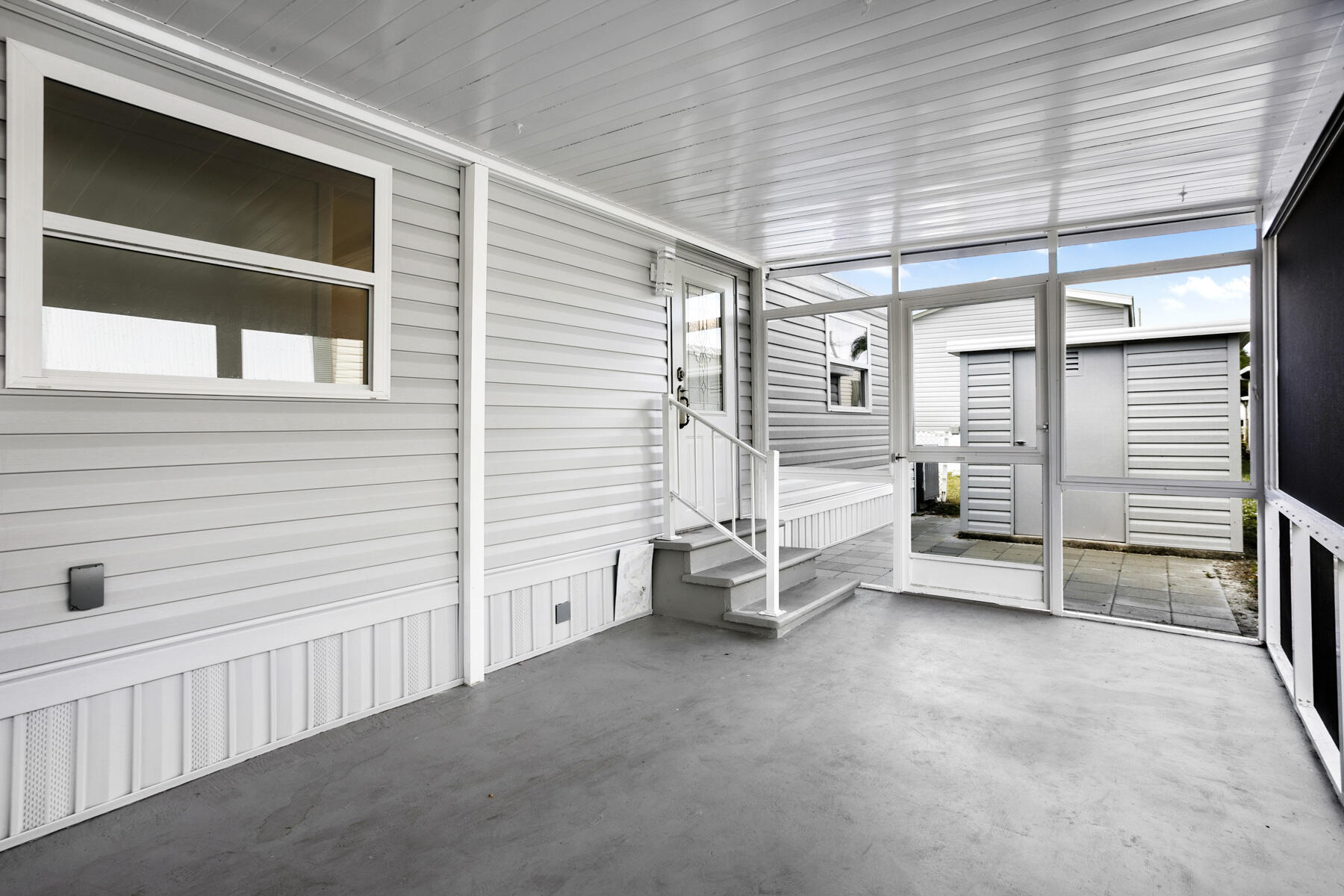 3003 Bimini Bay Boynton Beach, FL 33436 - Photo 20 of 31 a view of a porch with a bench