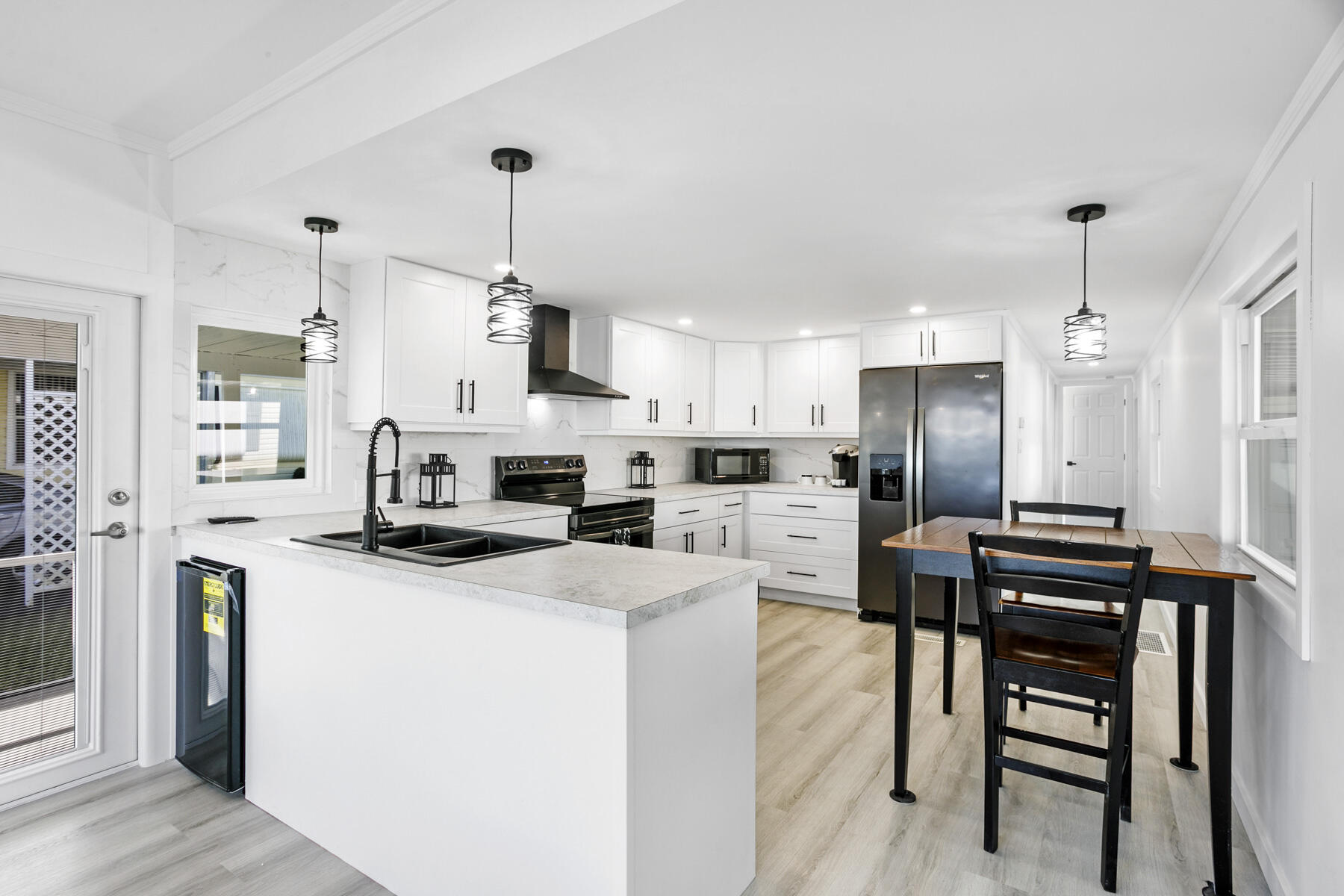 3003 Bimini Bay Boynton Beach, FL 33436 - Photo 2 of 31 a kitchen that has a lot of cabinets a sink and a refrigerator