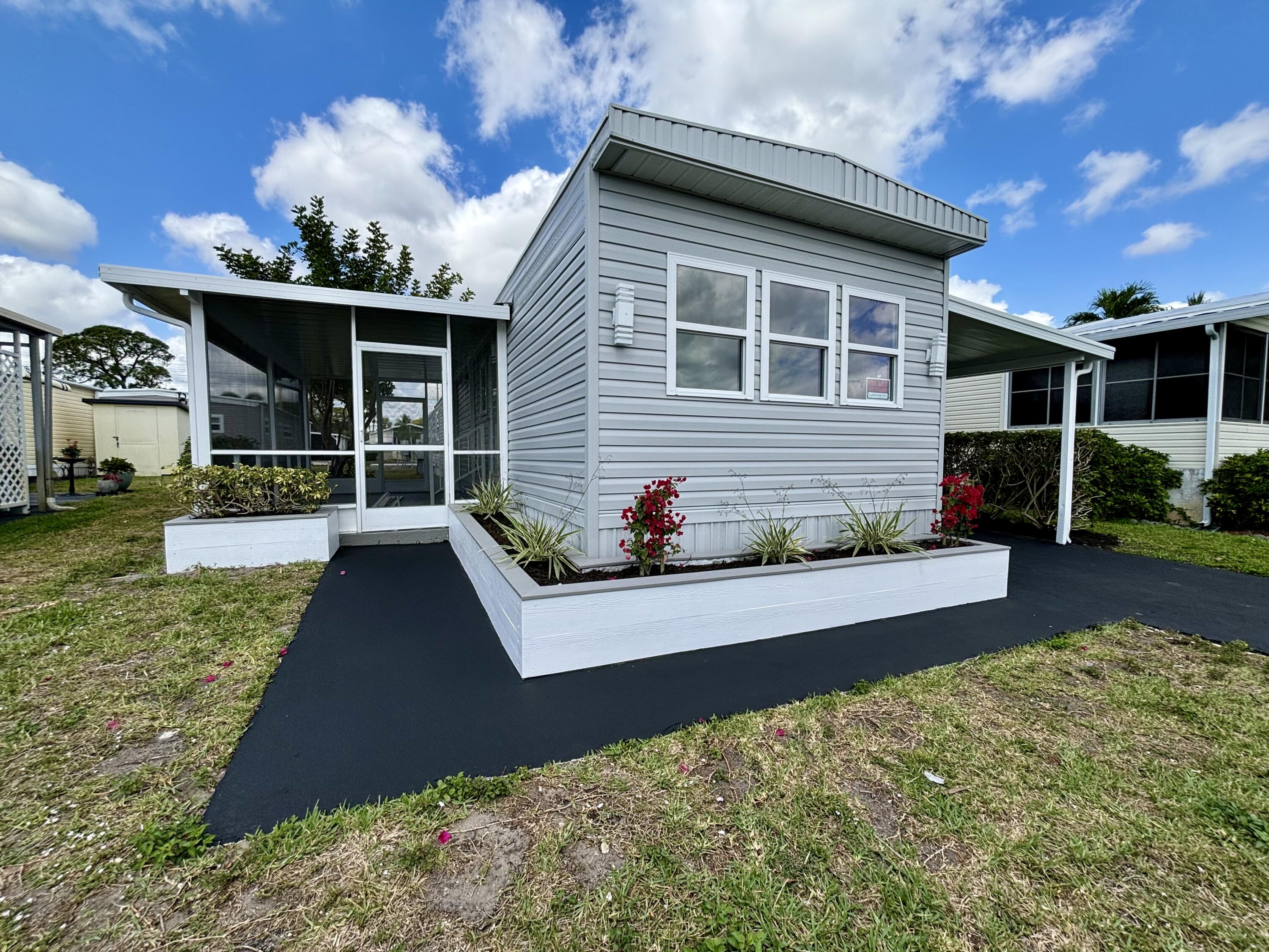 3003 Bimini Bay Boynton Beach, FL 33436 - Photo 22 of 31 a front view of house with yard