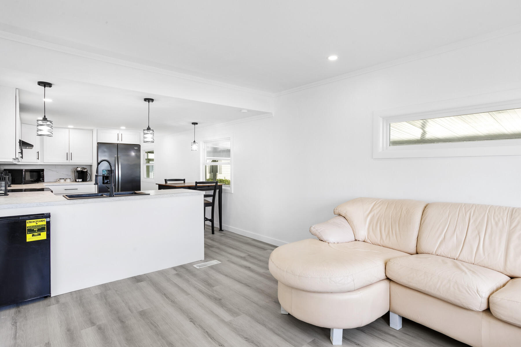 3003 Bimini Bay Boynton Beach, FL 33436 - Photo 6 of 31 a living room with kitchen island furniture and a kitchen view