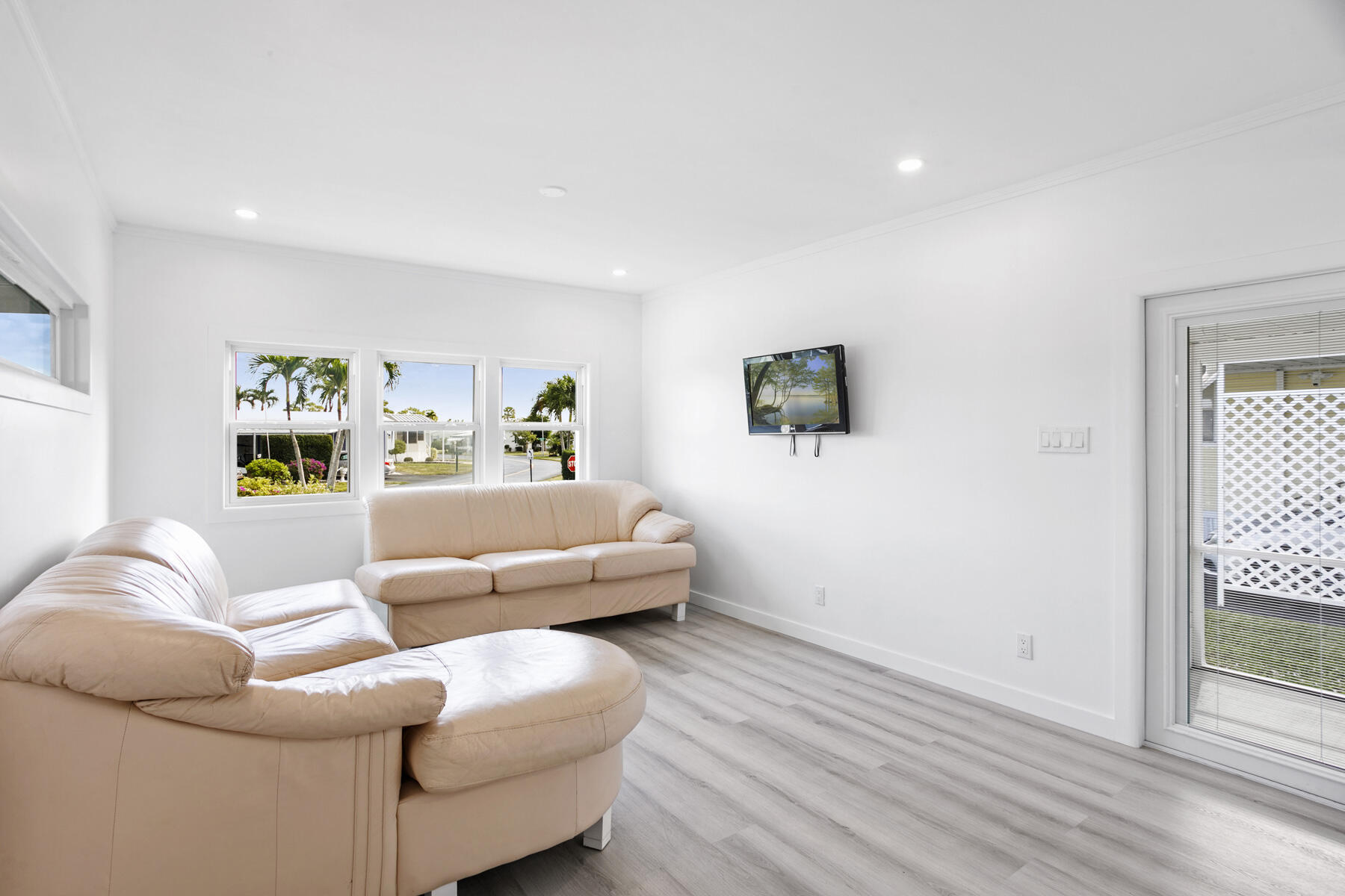 3003 Bimini Bay Boynton Beach, FL 33436 - Photo 8 of 31 a living room with furniture and a flat screen tv