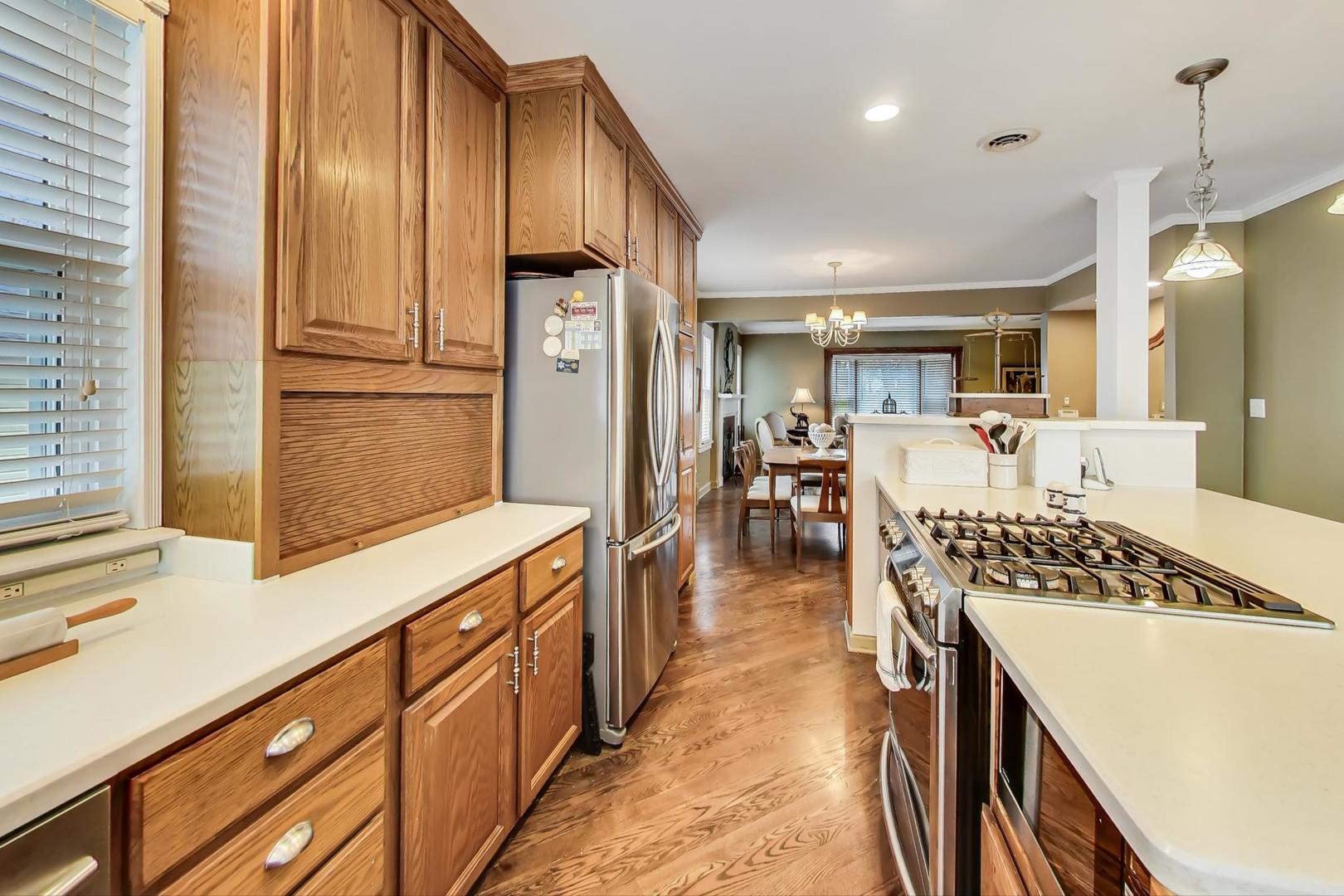 1665 Harding Road Northfield, IL 60093 - Photo 6 of 30 a kitchen with counter top space and refrigerator