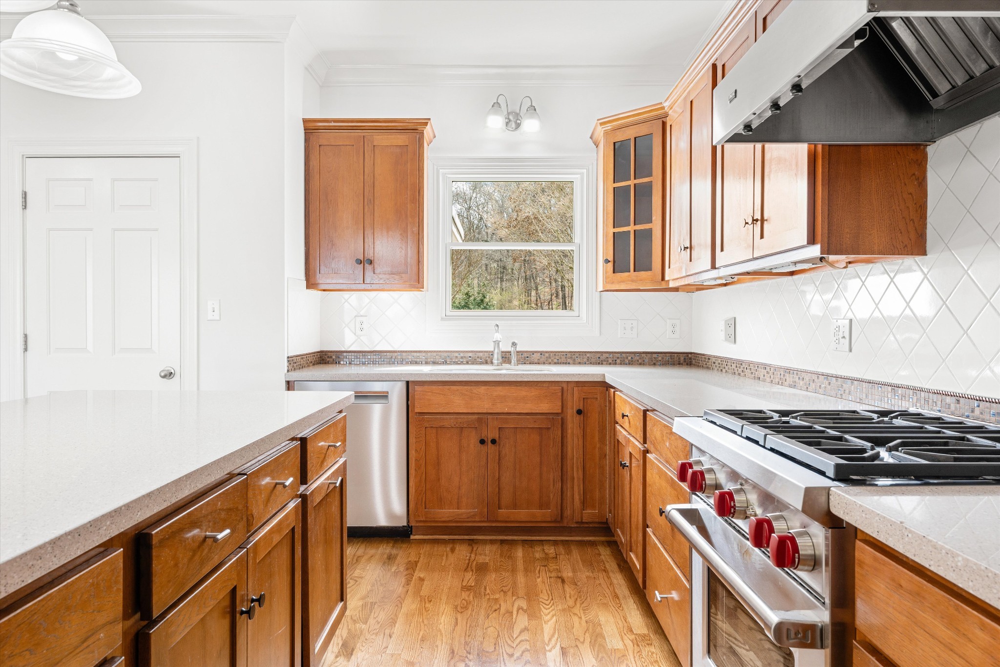 3863 Saundersville Ferry Road Mount Juliet, TN 37122 - Photo 14 of 83 a kitchen with granite countertop a sink cabinets stainless steel appliances and a window