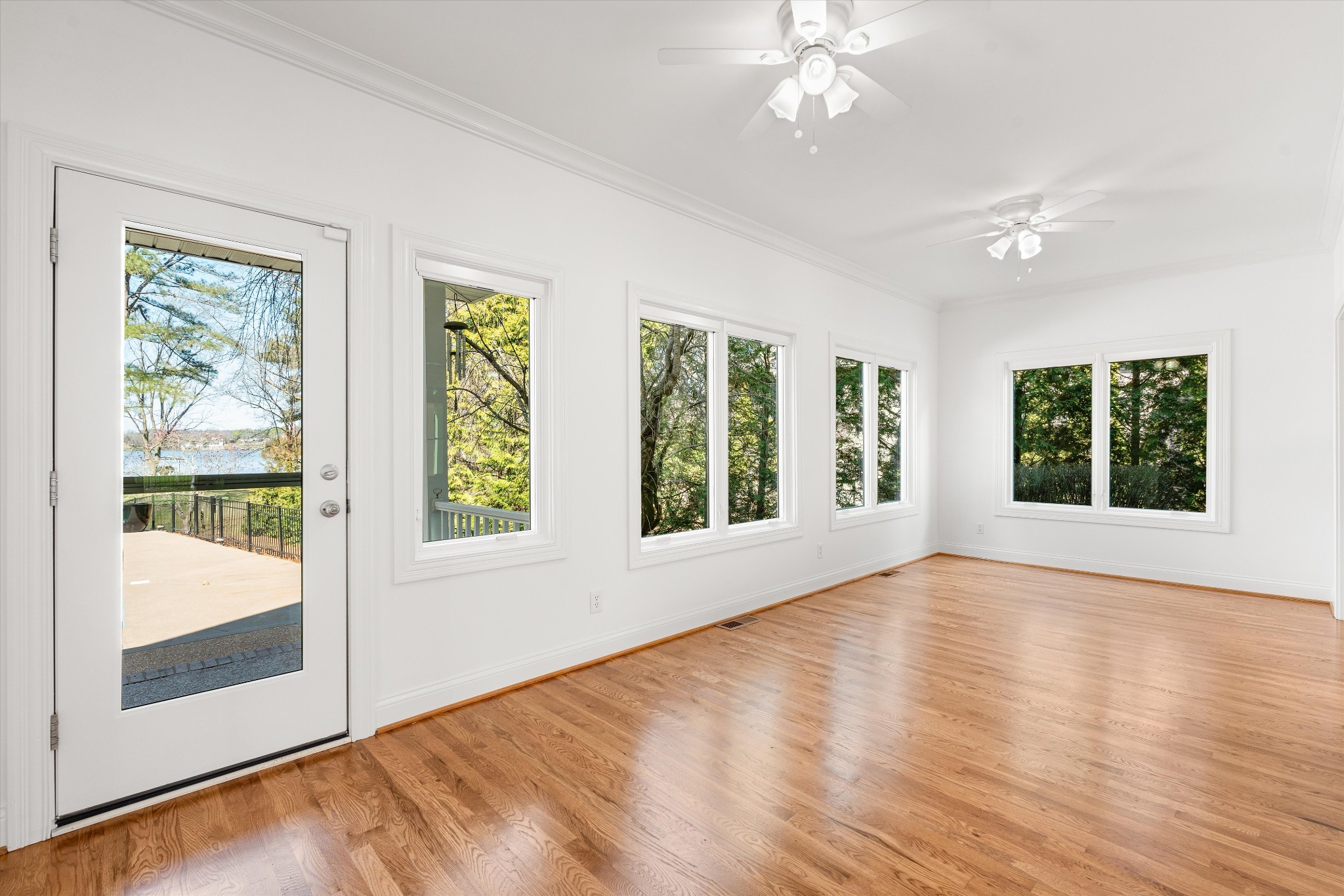 3863 Saundersville Ferry Road Mount Juliet, TN 37122 - Photo 20 of 83 a view of an empty room with wooden floor and a window