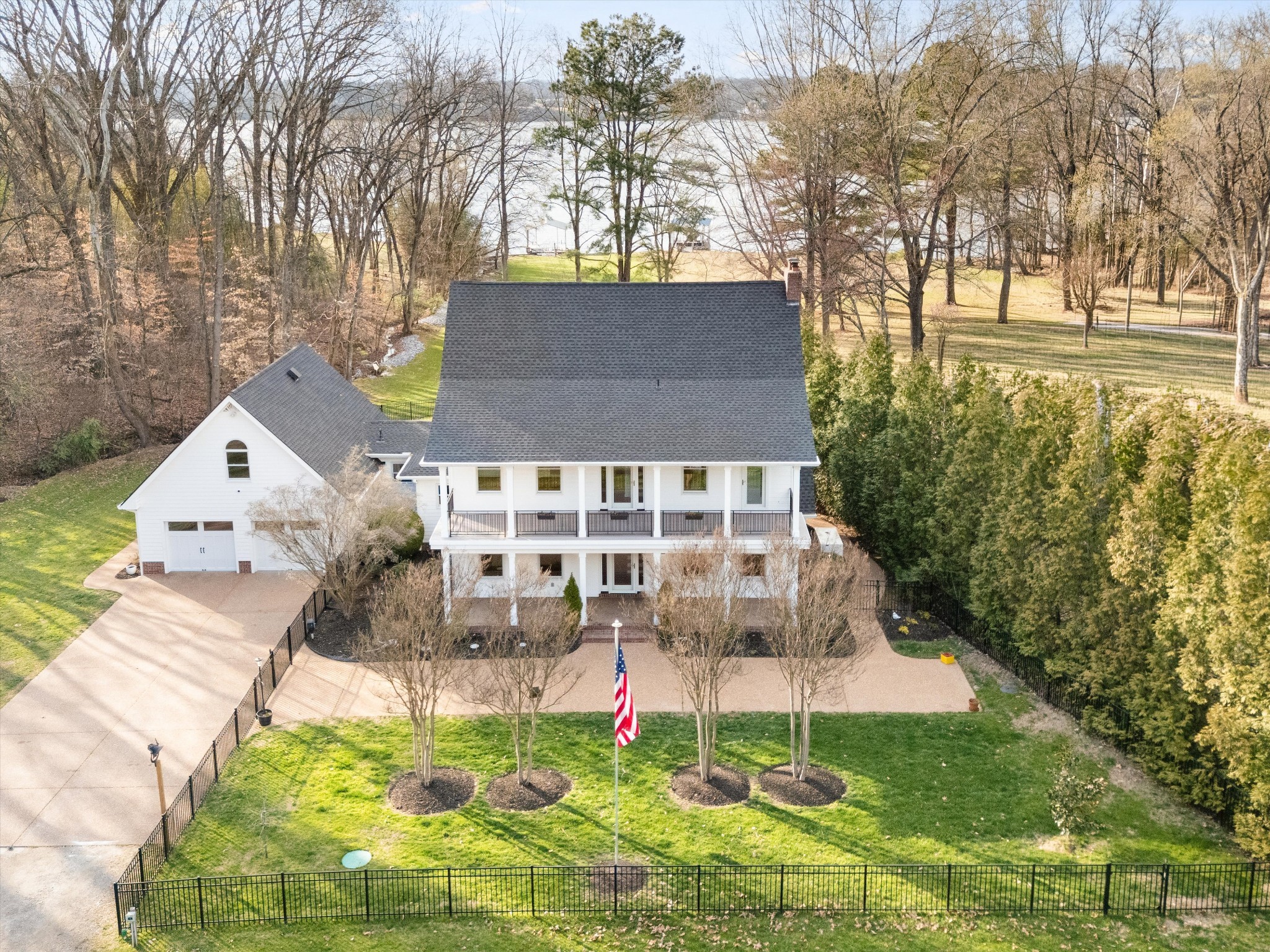 3863 Saundersville Ferry Road Mount Juliet, TN 37122 - Photo 2 of 83 a front view of a house with a yard and fountain in middle
