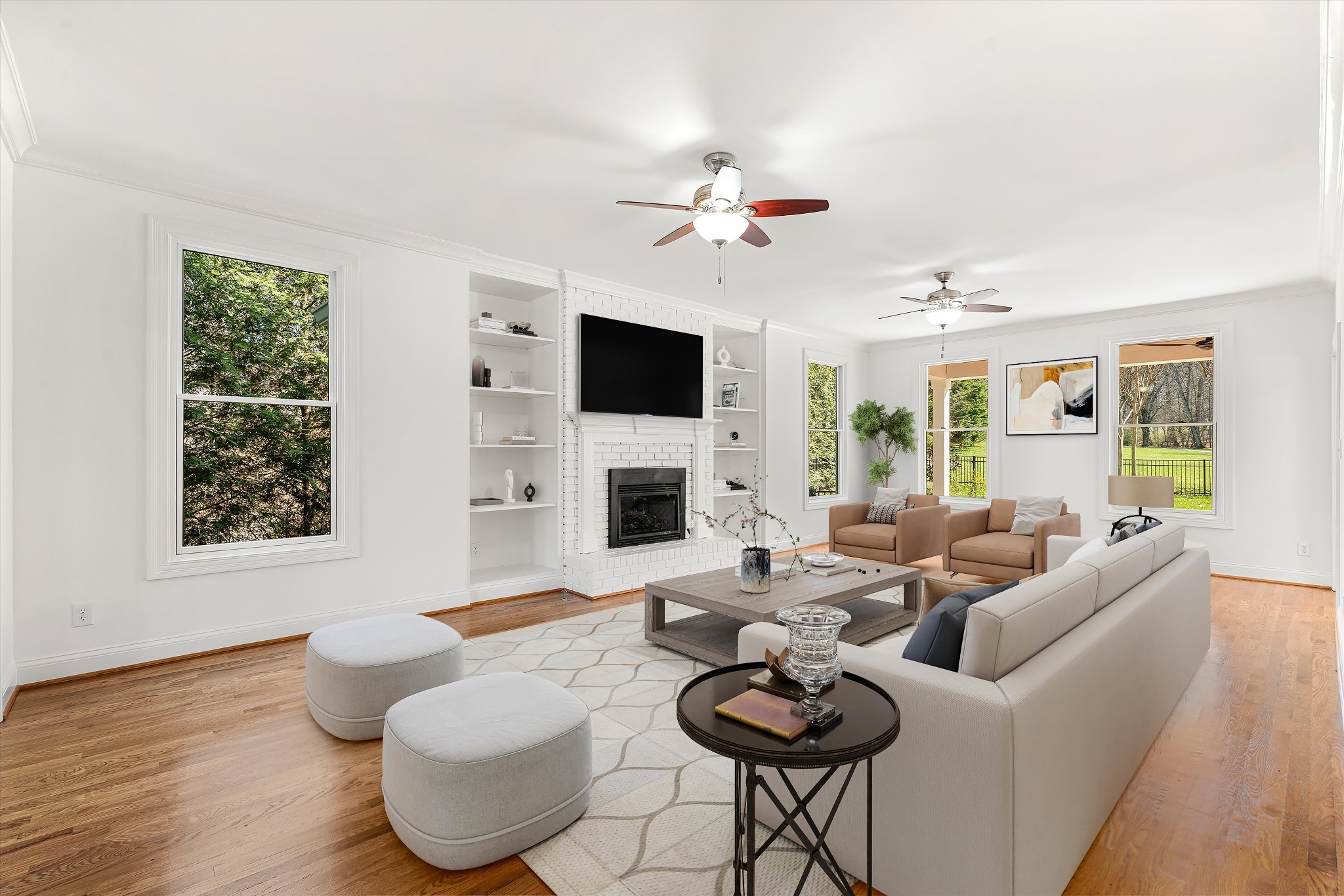 3863 Saundersville Ferry Road Mount Juliet, TN 37122 - Photo 22 of 83 a living room with furniture a fireplace and a flat screen tv