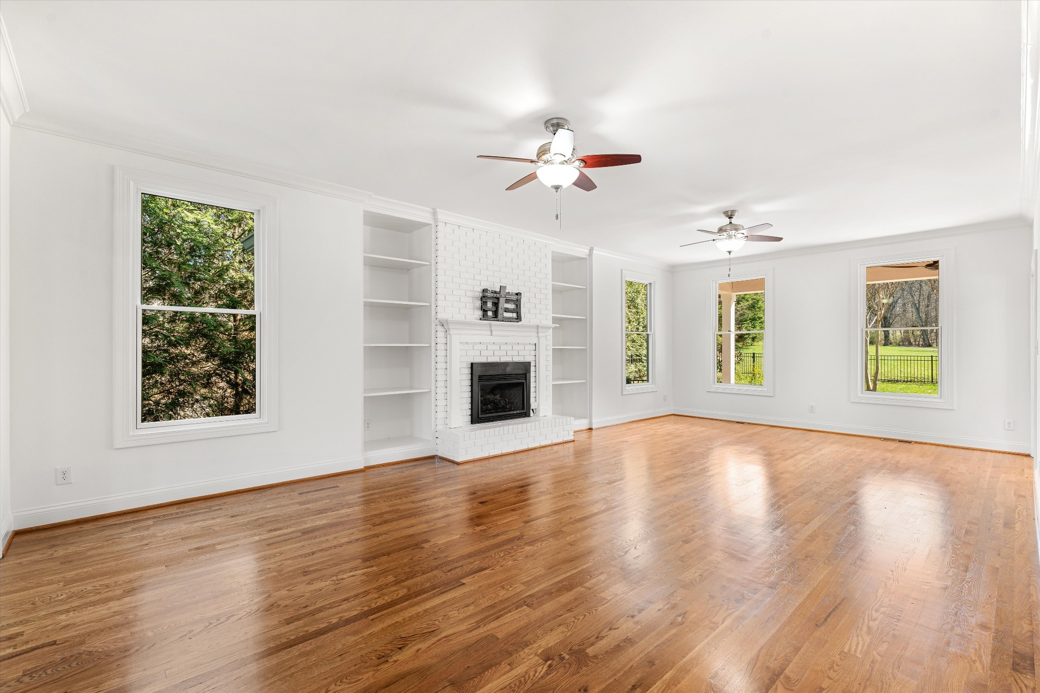 3863 Saundersville Ferry Road Mount Juliet, TN 37122 - Photo 23 of 83 a view of an empty room with a window and wooden floor