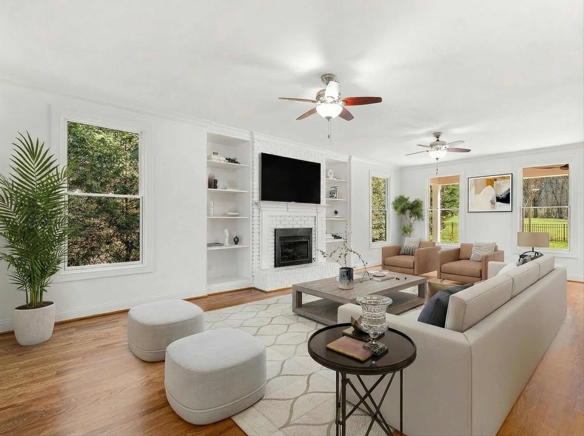 3863 Saundersville Ferry Road Mount Juliet, TN 37122 - Photo 25 of 83 a living room with furniture a fireplace and a flat screen tv