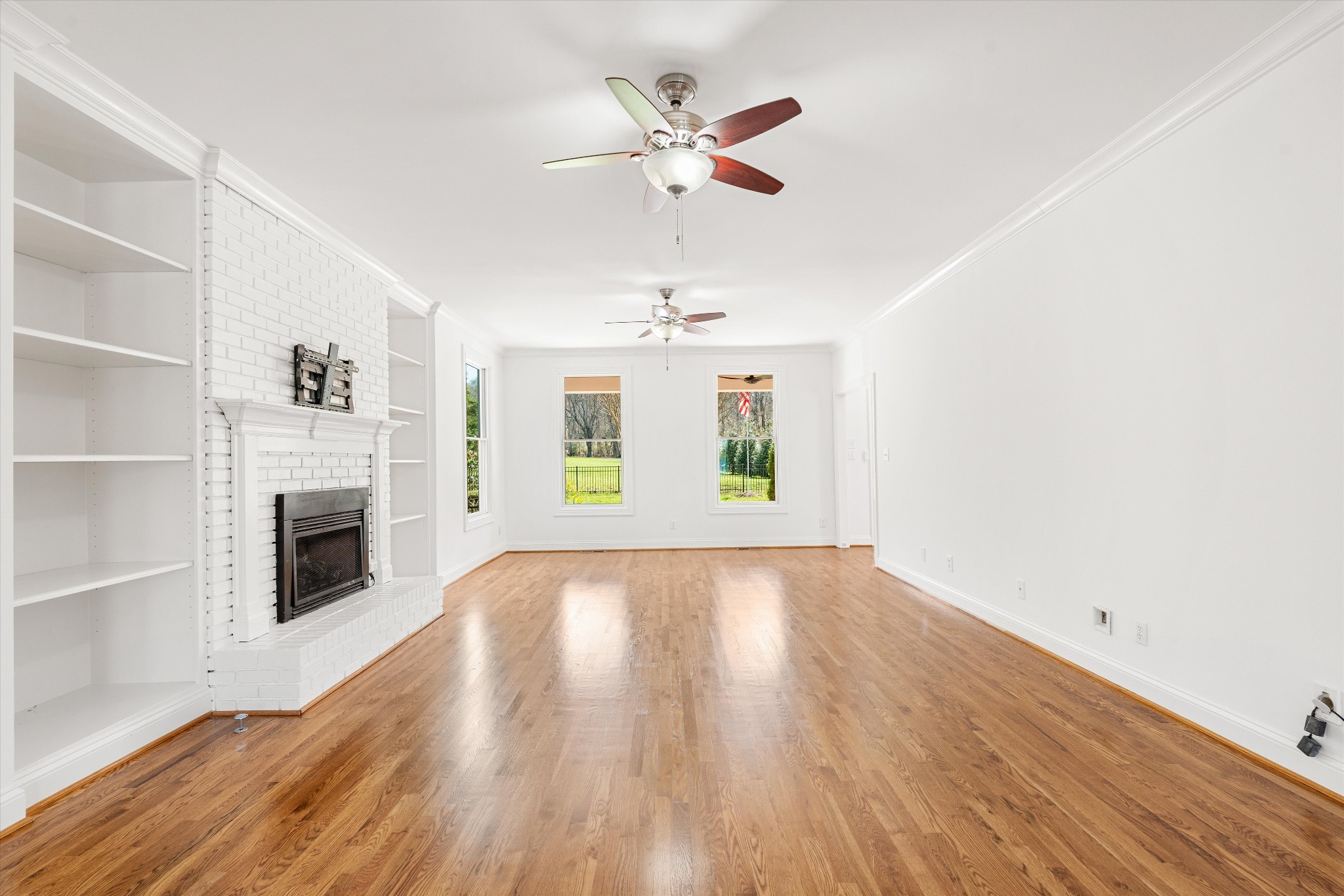 3863 Saundersville Ferry Road Mount Juliet, TN 37122 - Photo 26 of 83 a view of an empty room with a fireplace and a window