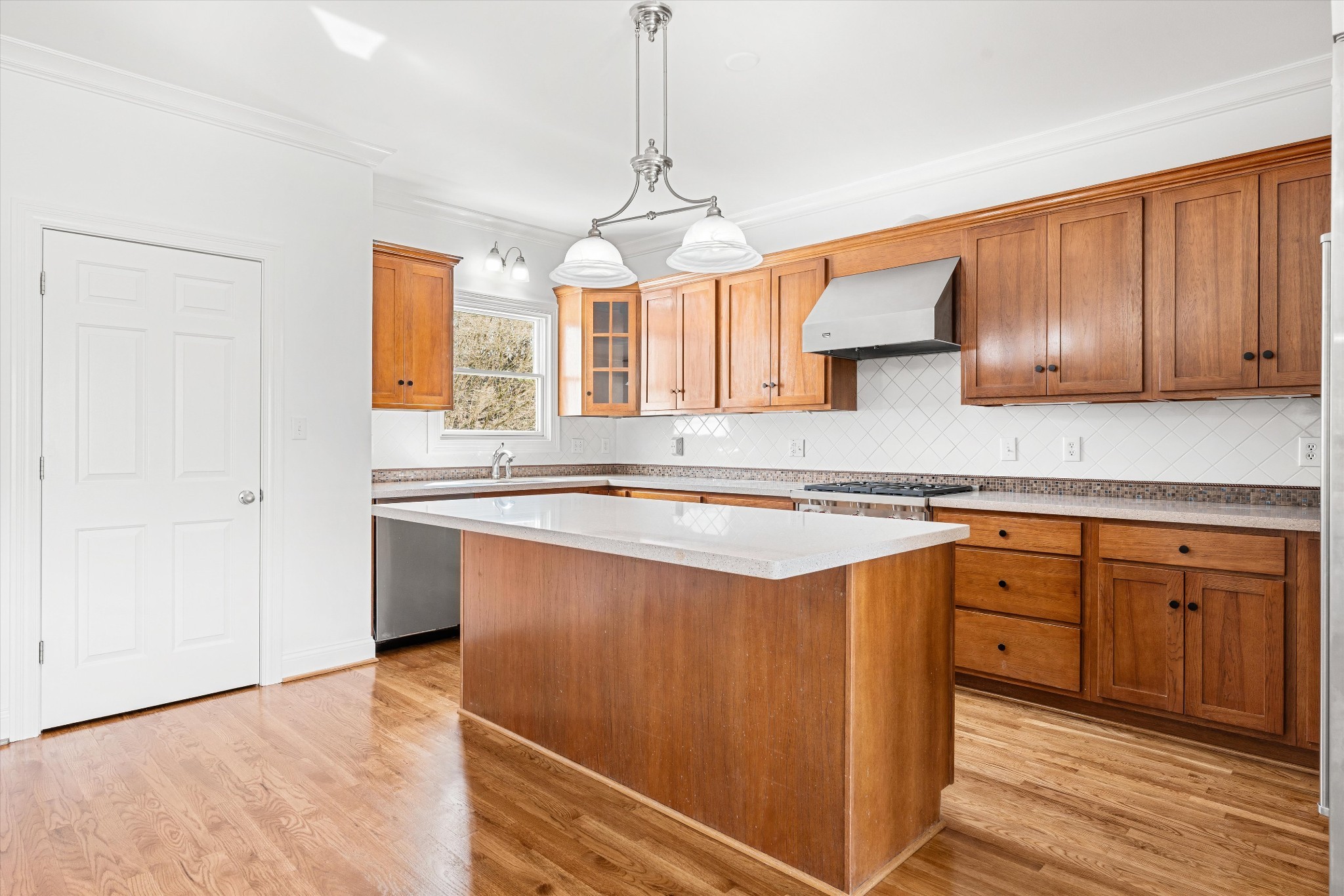 3863 Saundersville Ferry Road Mount Juliet, TN 37122 - Photo 28 of 83 a kitchen with stainless steel appliances granite countertop wooden cabinets a sink and dishwasher a stove with wooden floor
