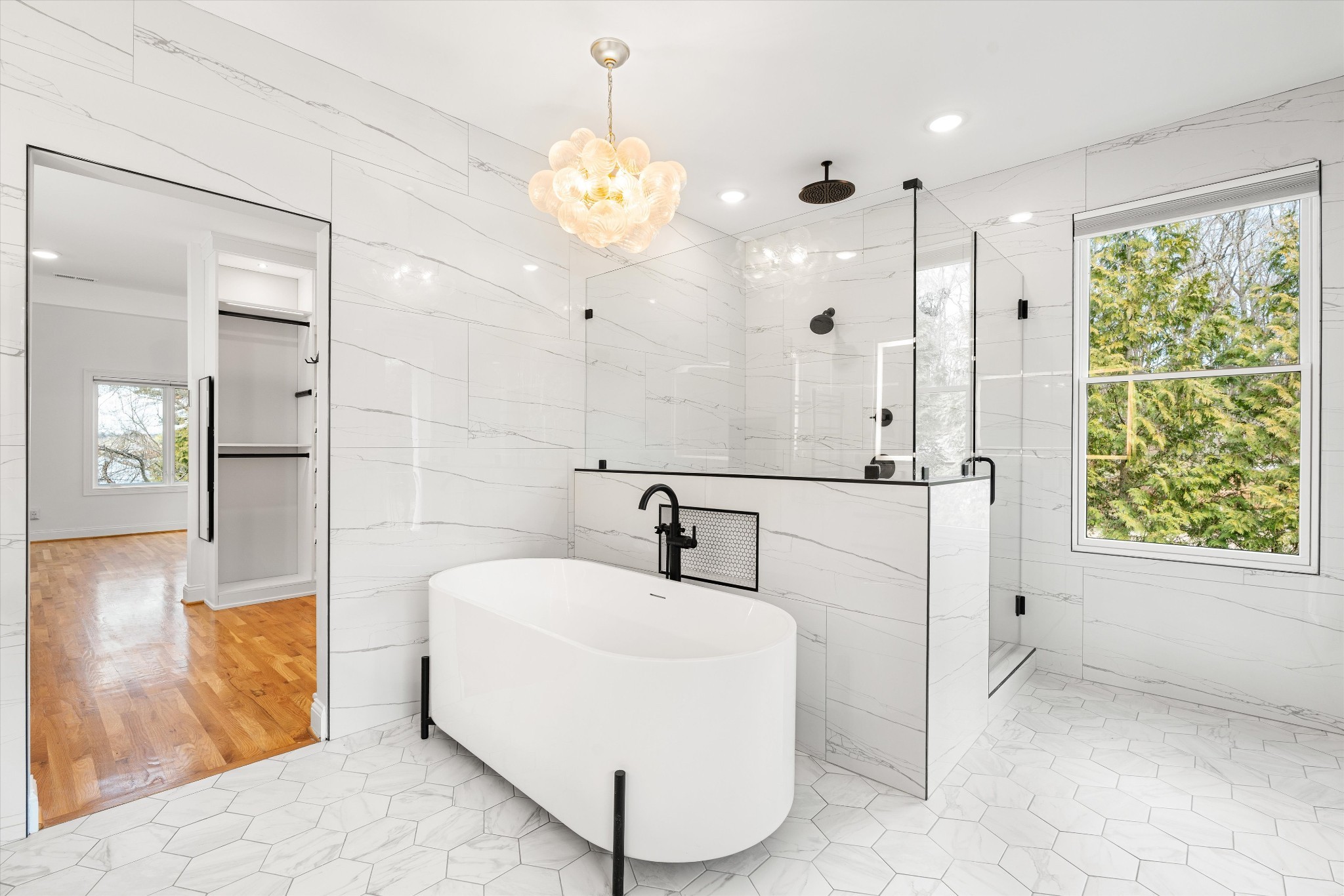 3863 Saundersville Ferry Road Mount Juliet, TN 37122 - Photo 42 of 83 a bathroom with a sink a large mirror and a shower