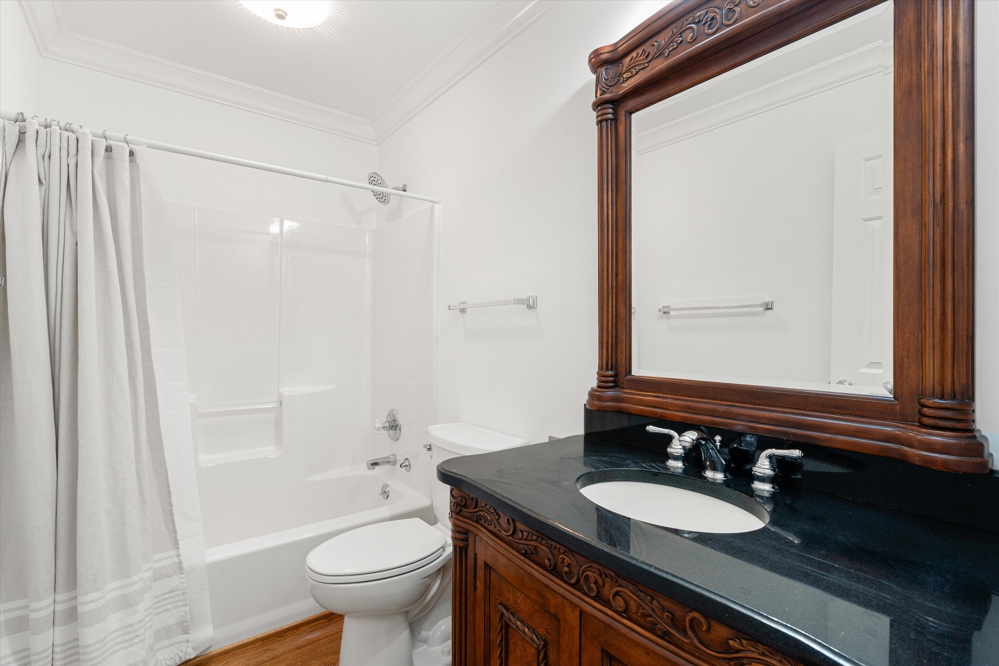 3863 Saundersville Ferry Road Mount Juliet, TN 37122 - Photo 46 of 83 a bathroom with a granite countertop sink toilet a mirror and shower