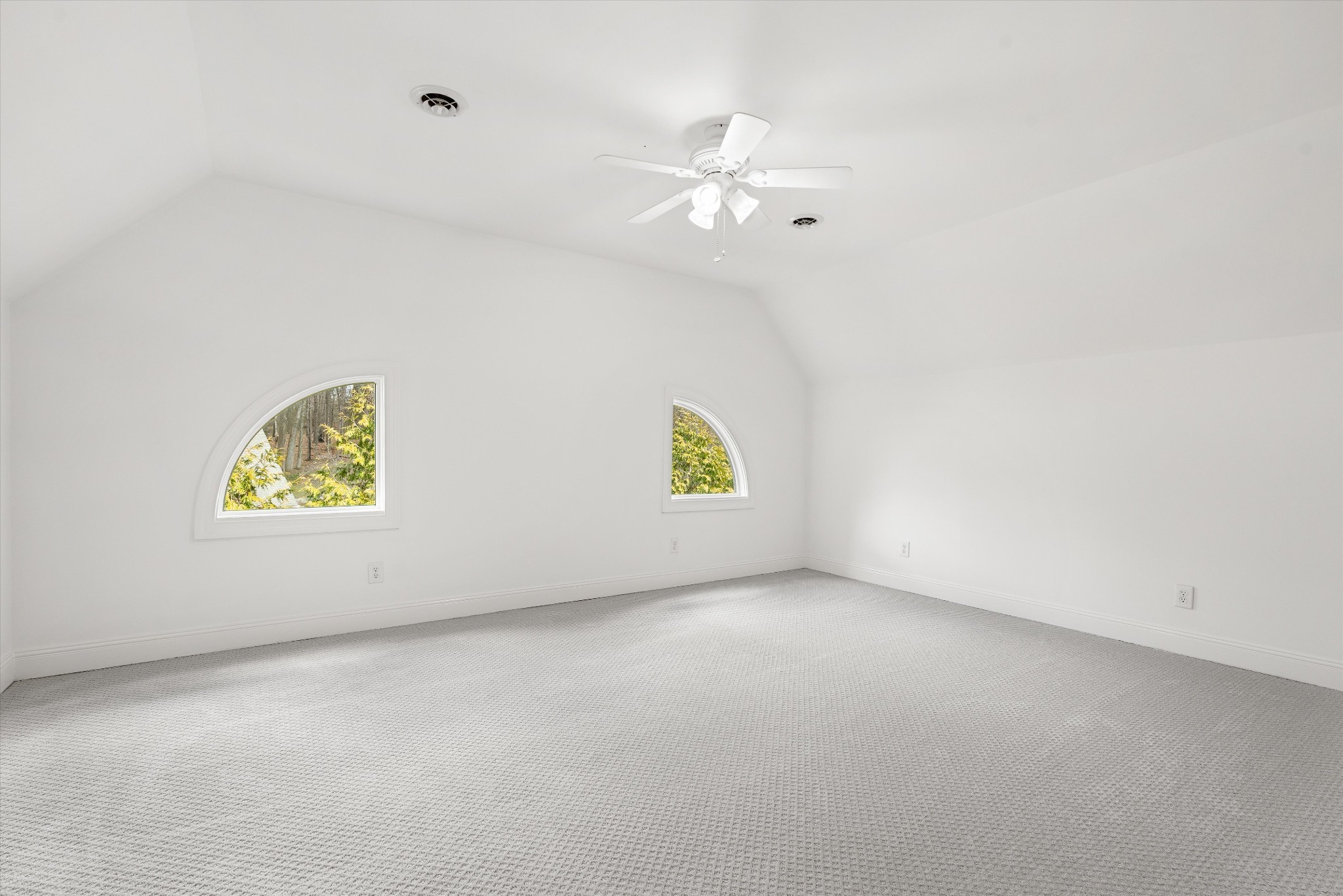 3863 Saundersville Ferry Road Mount Juliet, TN 37122 - Photo 54 of 83 an empty room with a chandelier fan and wooden floor