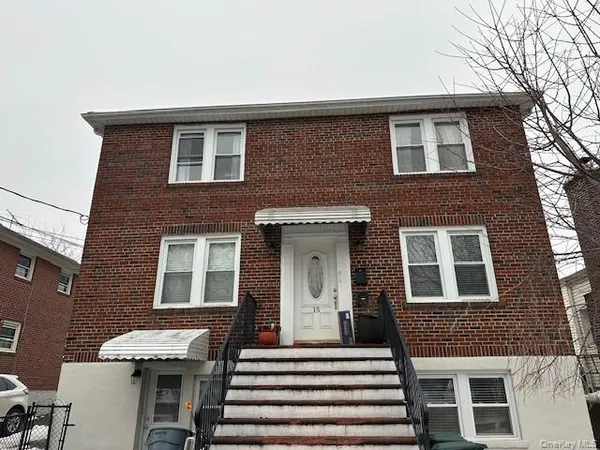 a front view of a house with a large windows