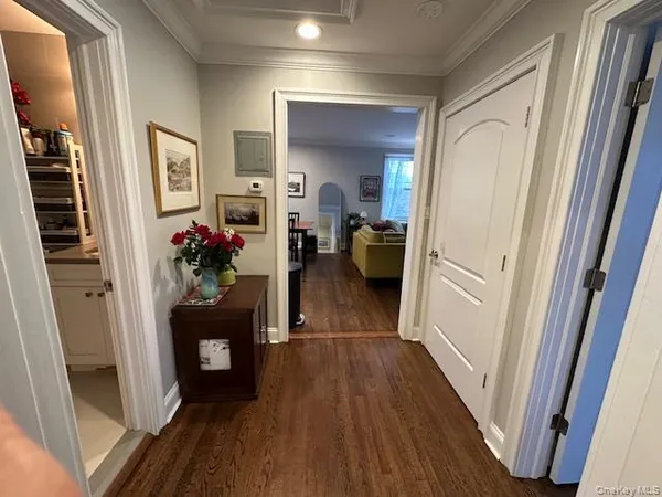 a view of a hallway view with wooden floor and furniture