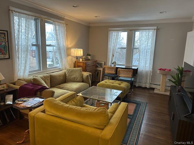 15 Juniper Road, Unit 2 Port Washington, NY 11050 - Photo 5 of 8 a living room with furniture and a large window