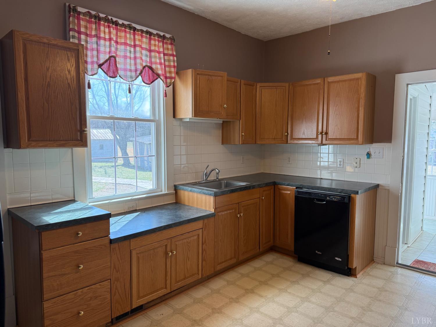 1431 High Peak Road Monroe, VA 24574 - Photo 12 of 24 a kitchen with stainless steel appliances granite countertop a sink and cabinets