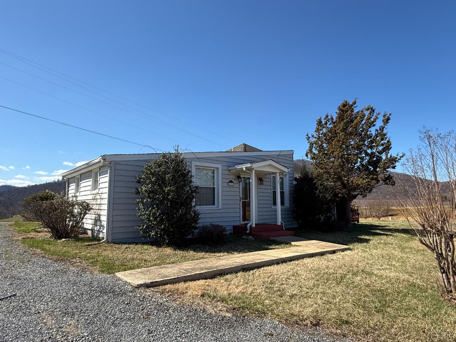1431 High Peak Road Monroe, VA 24574 - Photo 21 of 24 a front view of a house with a yard and garage