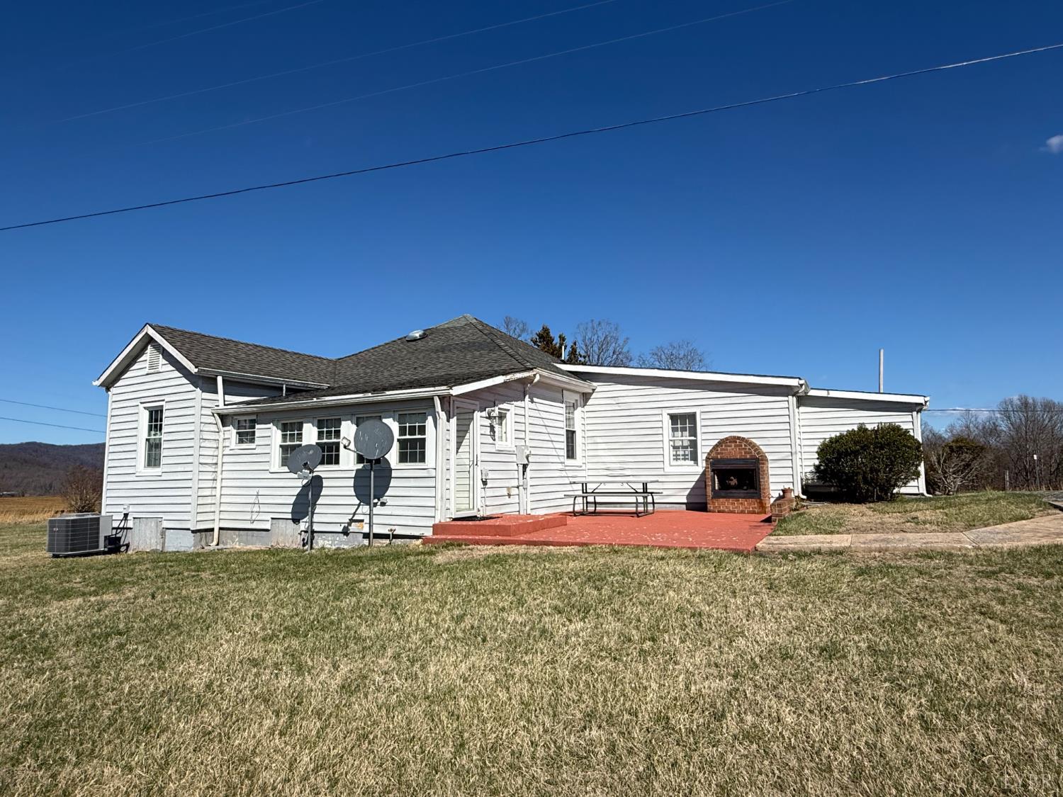 1431 High Peak Road Monroe, VA 24574 - Photo 5 of 24 a front view of a house with a yard