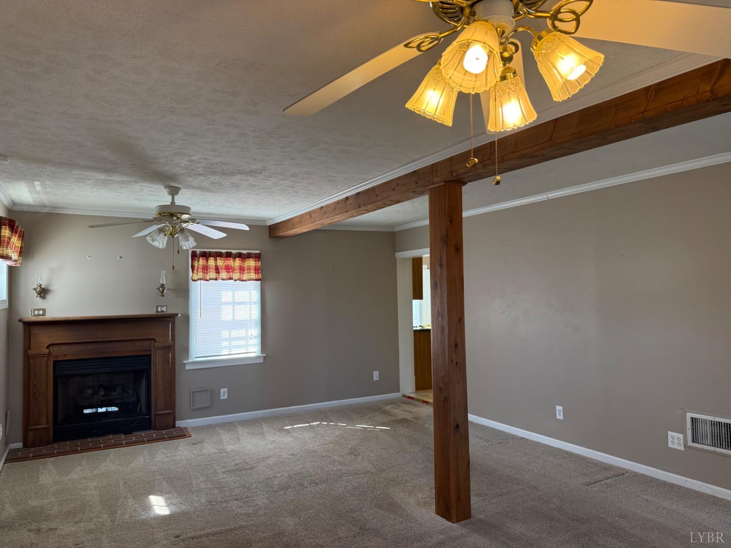 1431 High Peak Road Monroe, VA 24574 - Photo 7 of 24 a view of a livingroom with a fireplace and window