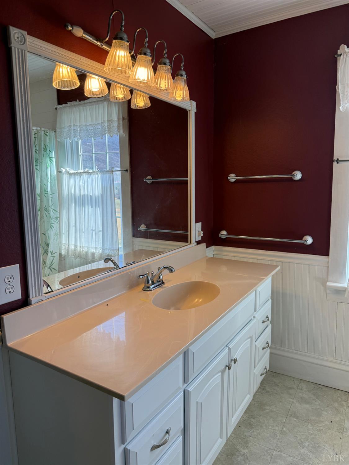 1431 High Peak Road Monroe, VA 24574 - Photo 8 of 24 a bathroom with a sink and a mirror