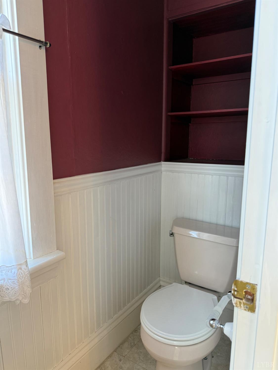 1431 High Peak Road Monroe, VA 24574 - Photo 9 of 24 a white toilet sitting next to a shower curtain
