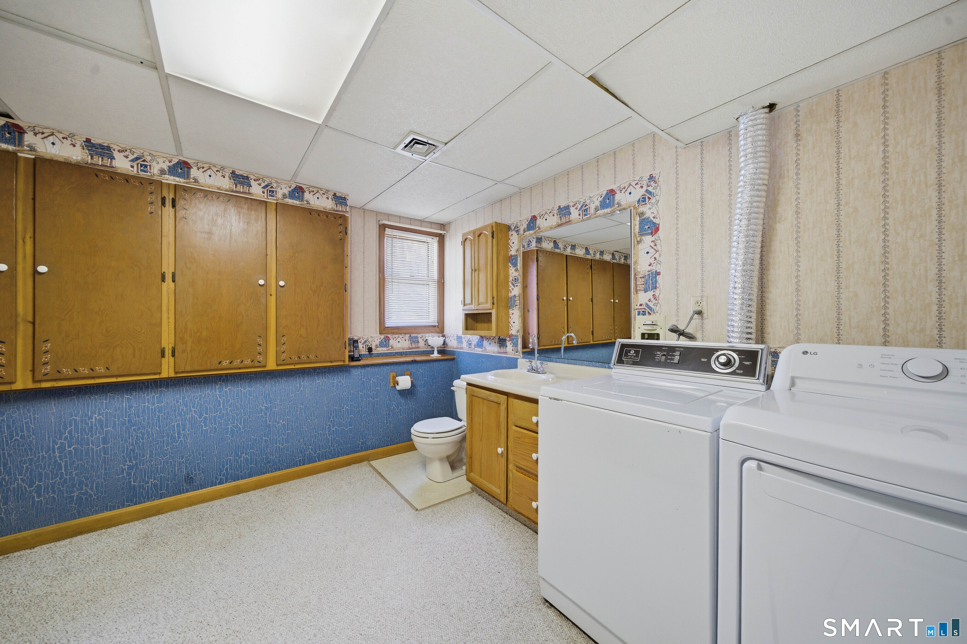 17 Spruceland Road Enfield, CT 06082 - Photo 34 of 40 Laundry room with large cabinets for additional storage