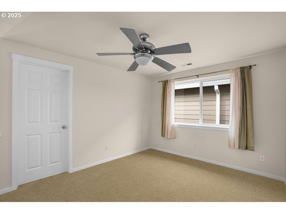 515 Northeast Suttle Street Portland, OR 97211 - Photo 14 of 28 a view of an empty room with a window