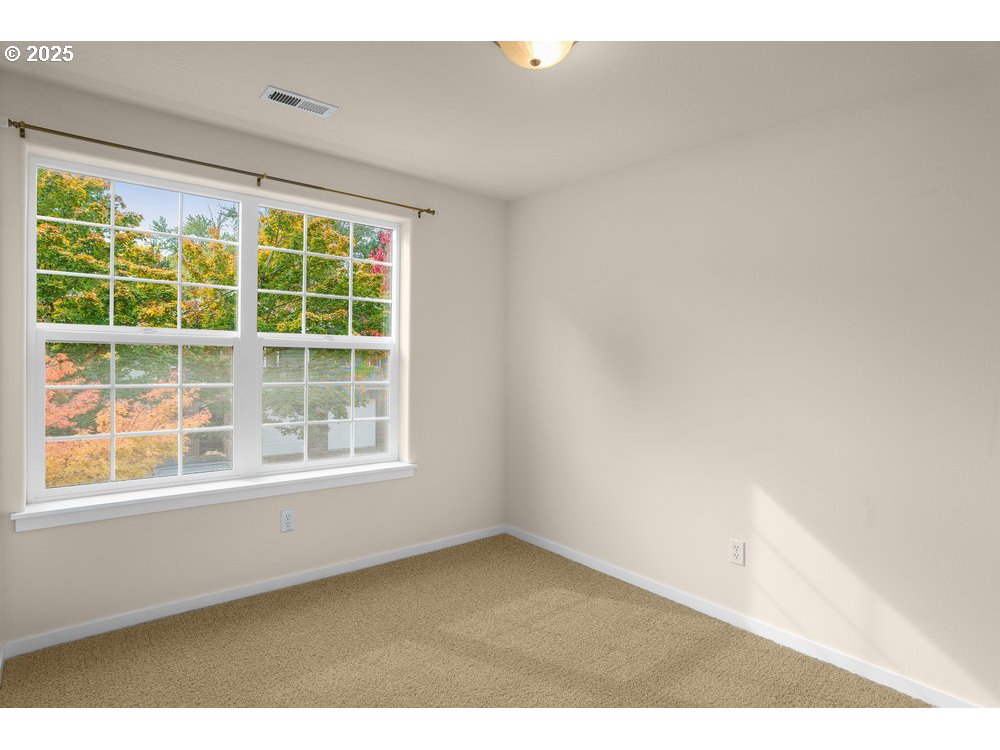 515 Northeast Suttle Street Portland, OR 97211 - Photo 15 of 28 a view of an empty room with a window