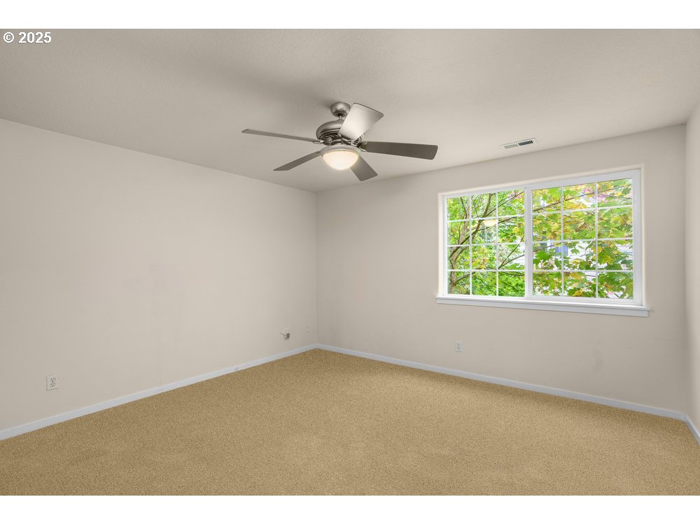 515 Northeast Suttle Street Portland, OR 97211 - Photo 19 of 28 a view of an empty room with a window