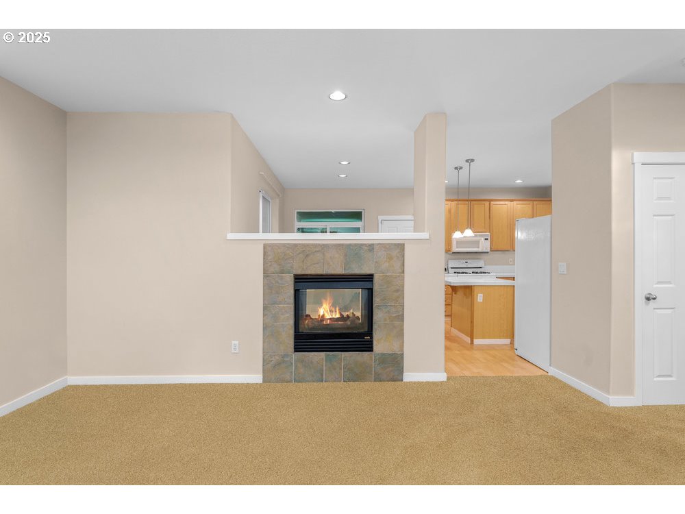 515 Northeast Suttle Street Portland, OR 97211 - Photo 2 of 28 a living room with furniture and a fireplace