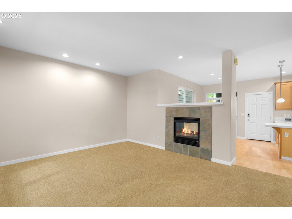 515 Northeast Suttle Street Portland, OR 97211 - Photo 3 of 28 a view of an empty room and fire place