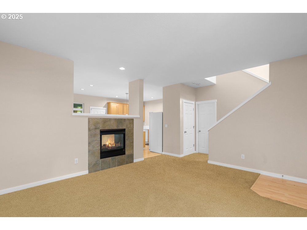 515 Northeast Suttle Street Portland, OR 97211 - Photo 4 of 28 a view of an empty room and fire place
