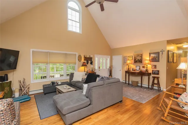 a living room with furniture fireplace and a flat screen tv
