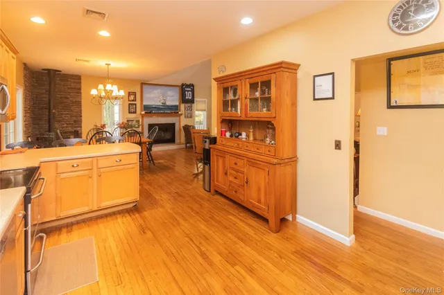 a kitchen with stainless steel appliances granite countertop a stove and a refrigerator