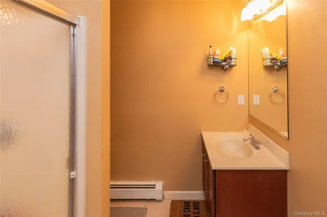 a living room with lots of furniture and kitchen view