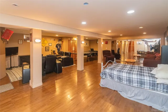 a room with table chairs and wooden floor