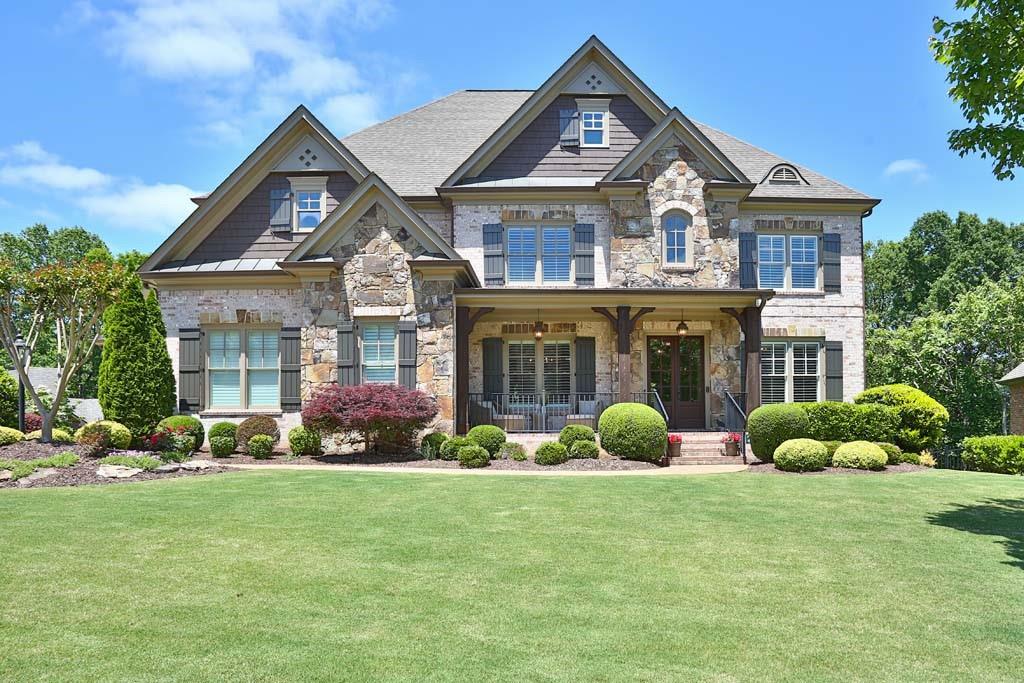 1570 Bramble Bush Way Suwanee, GA 30024 - Photo 1 of 1 a front view of a house with garden