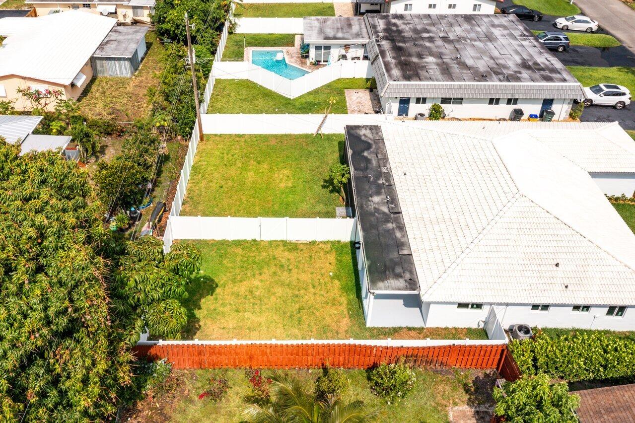 245 Southwest 6th Street Boca Raton, FL 33432 - Photo 26 of 40 a view of swimming pool with a yard