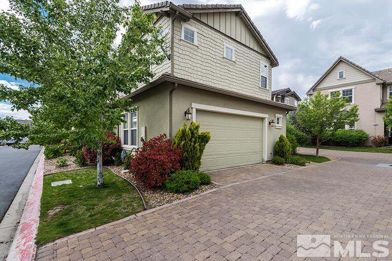 7677 Stone Bluff Way Reno, NV 89523 - Photo 17 of 17 a front view of house with a garden