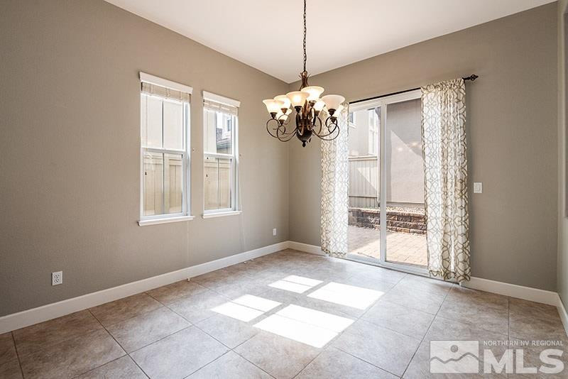 7677 Stone Bluff Way Reno, NV 89523 - Photo 4 of 17 a view of an empty room with a window