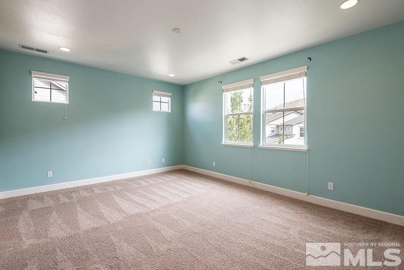 7677 Stone Bluff Way Reno, NV 89523 - Photo 7 of 17 a view of an empty room with a window