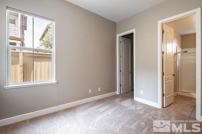 7677 Stone Bluff Way Reno, NV 89523 - Photo 10 of 17 an empty room with windows and closet
