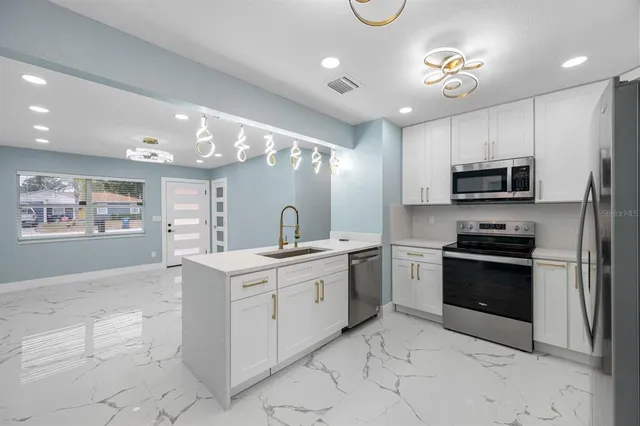 a spacious bathroom with a toilet a sink and mirror